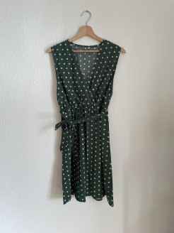 Green mid-length dress with polka dots