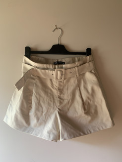 Cream shorts with leatherette belt
