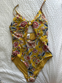 Yellow one-piece swimming costume with flowers