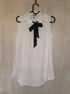 Nice cream top with black ribbon for the neckline