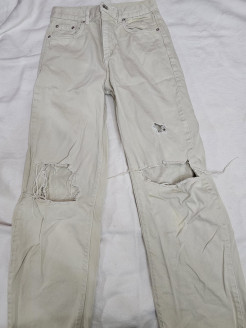 Beige trousers with hole