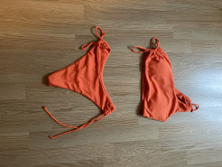 orange swimming costume