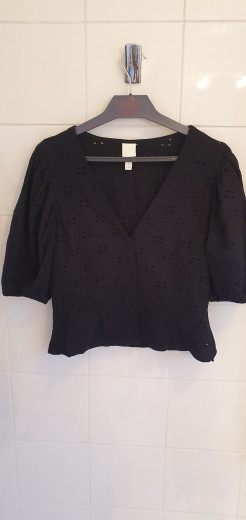 Black top with English embroidery and puffed sleeves