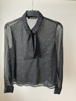 Black shirt with white polka dots