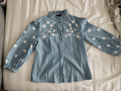 Denim blouse with white flowers