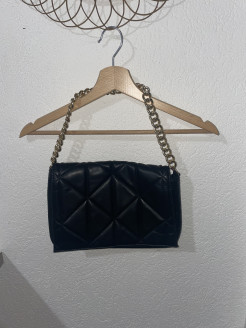 Black handbag with gold chain