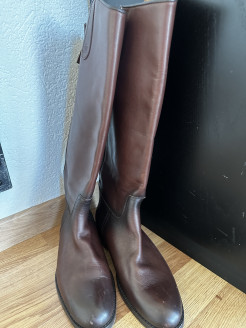 Brown and black riding boots