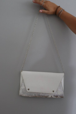 White and silver clutch bag