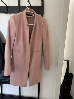 Manteau rose pâle