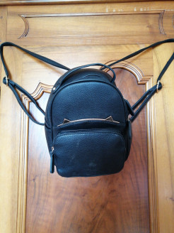 Small black and gold backpack
