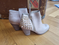 Beige leather ankle boots with studded heels