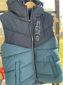 Blue sleeveless down jacket