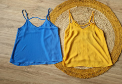 Two yellow and blue tops