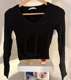 Black V-neck jumper