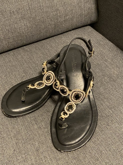 black sandals with embellishments