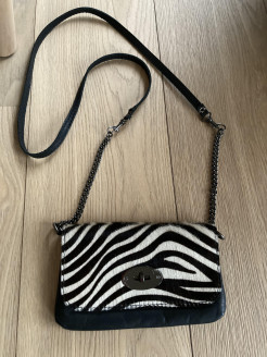 Small zebra and black leather bag