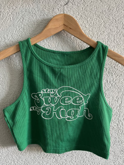 Green short top with writing