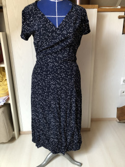 Navy blue mid-length wrap dress with polka dots